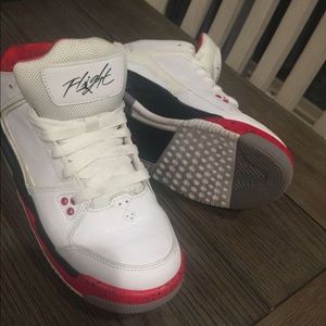 Black,red, and white Jordan’s